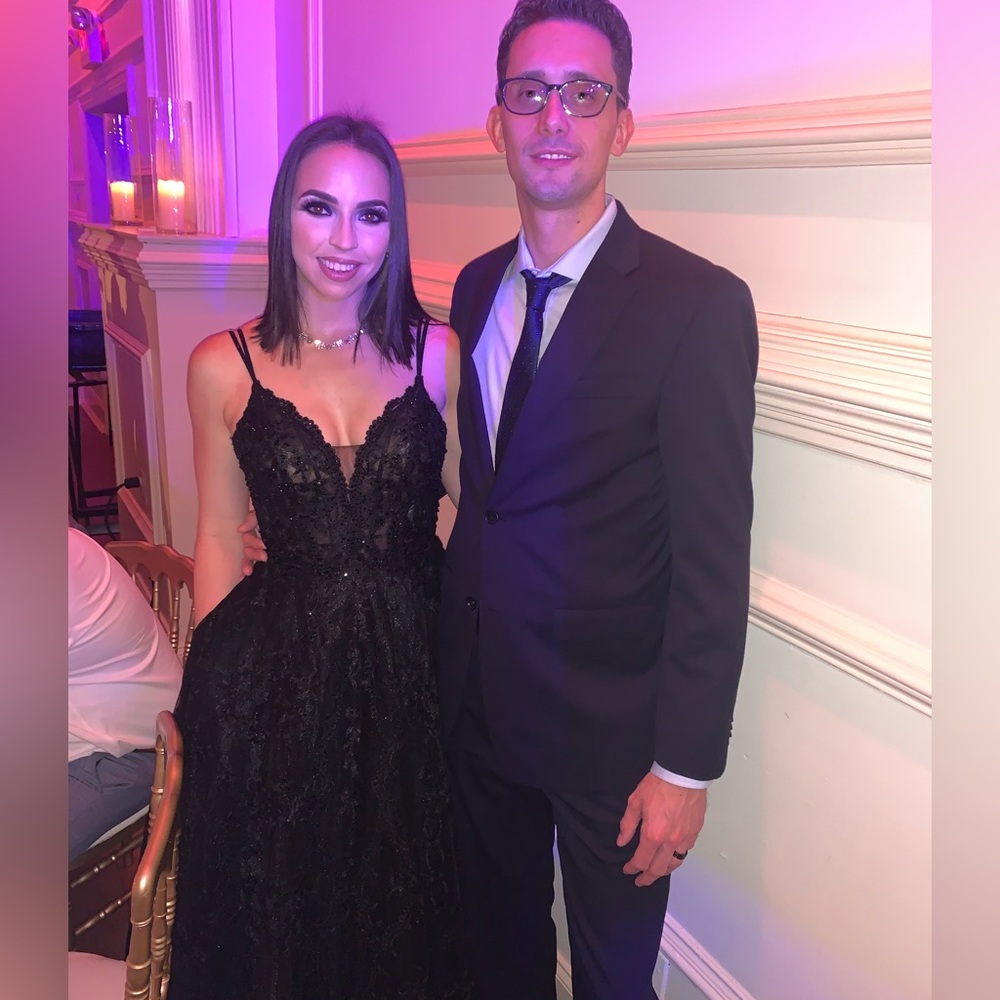 Black lace gown with lace detailing.